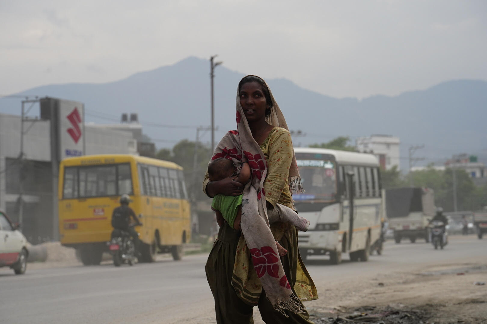 Homeless woman with a baby in her arms in Kathmandu
